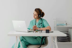 A doctor using Telemedicine for Surgeons to call a patient