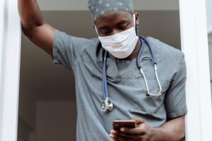surgeon using surgimate practice mobile app to add post-surgery cpt codes